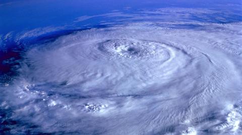 Hurricane forming above earth from space