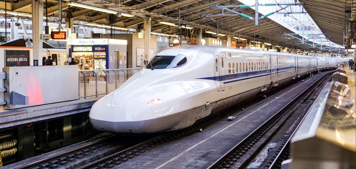 Trains provide fast, clean, fun, low carbon transport with global reach. Photo: Fikri Rasyid - unsplash.com Bullet train in station