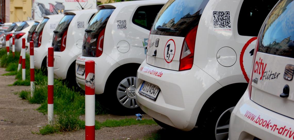Car clubs offer a cost-effective and flexible alternative to owning a car. Photo: Kenny2332 - Pixabay.com A row of white vehicles parked in a lot.