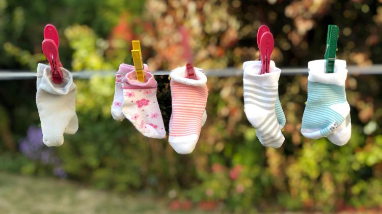 Baby socks hanging on a washing line