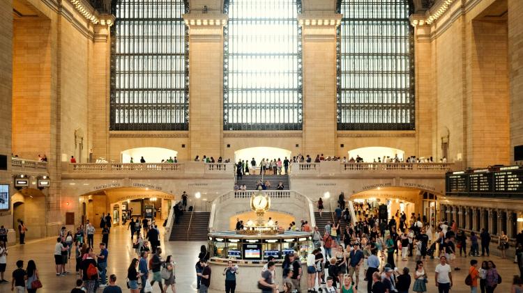 Almost all major cities have good rail links. Photo: Jad Limcaco - unsplash.com The interior of a busy urban station.