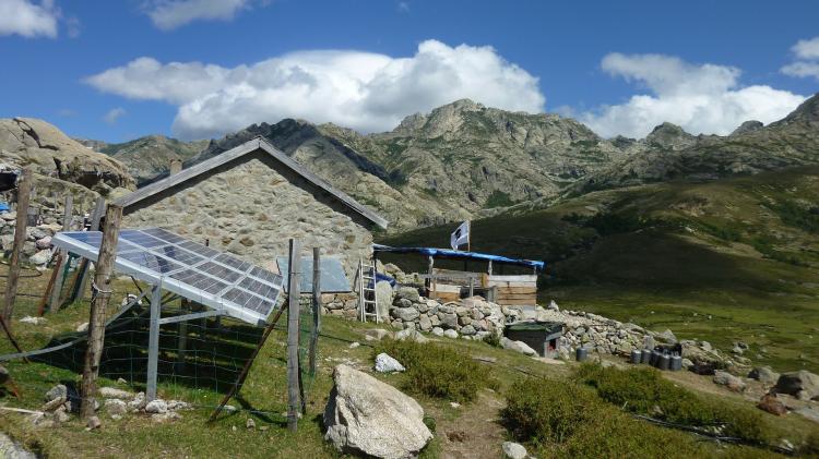 Solar Panels placed in the yard of a home located in the mountains