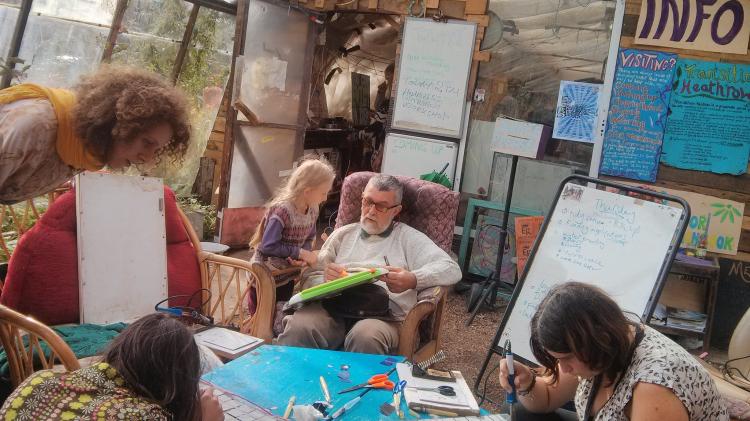 Community initiatives have social benefits including increased social capital, civic participation and inclusion. Photo: https://www.flickr.com/photos/transitionheathrow/20961048041/ under creative commons https://creativecommons.org/licenses/by/2.0/ People gathered in a room doing community projects
