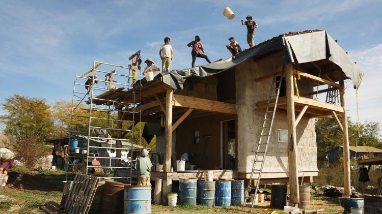 People working on building a home with smart materials